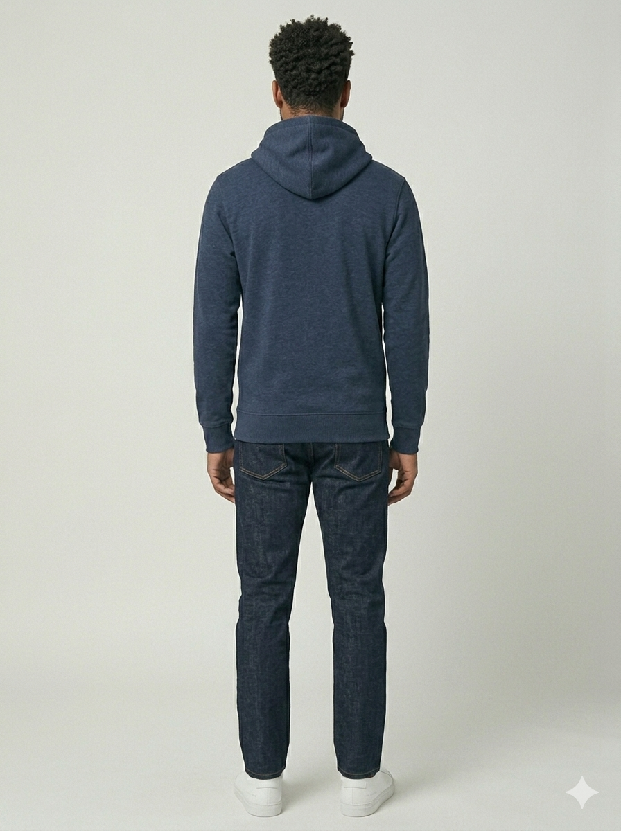 Person wearing a blue hoodie and jeans on a white background