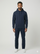 Man wearing a navy hoodie and pants on a white background